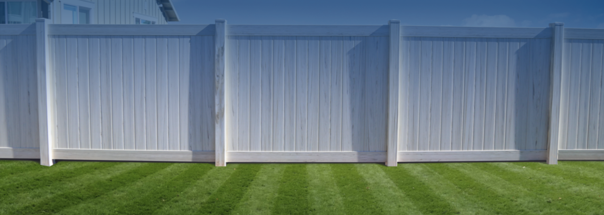 slider White privacy fence on grass